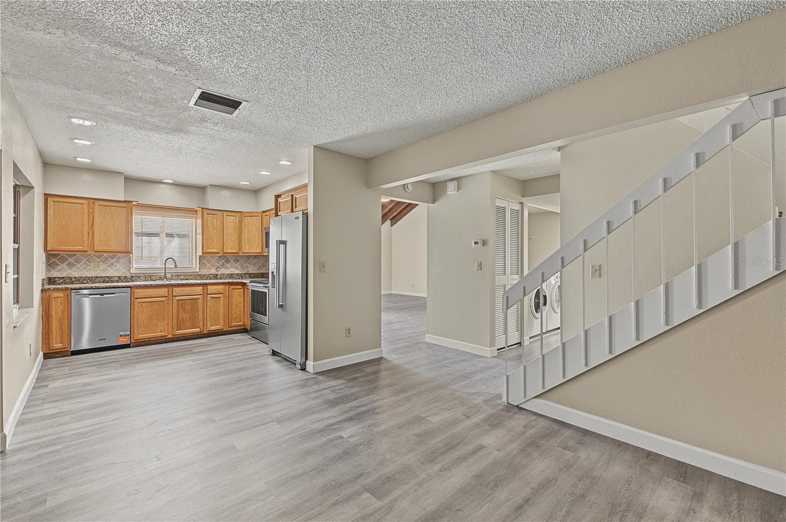 Stainless Steel Appliances, Patio off to the side, Laminate Flooring - 2729 FOXFIRE CT #C, CLEARWATER