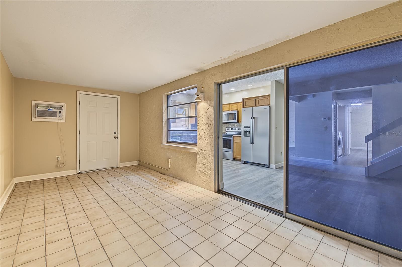 Side patio off of the kitchen. - 2729 FOXFIRE CT #C, CLEARWATER