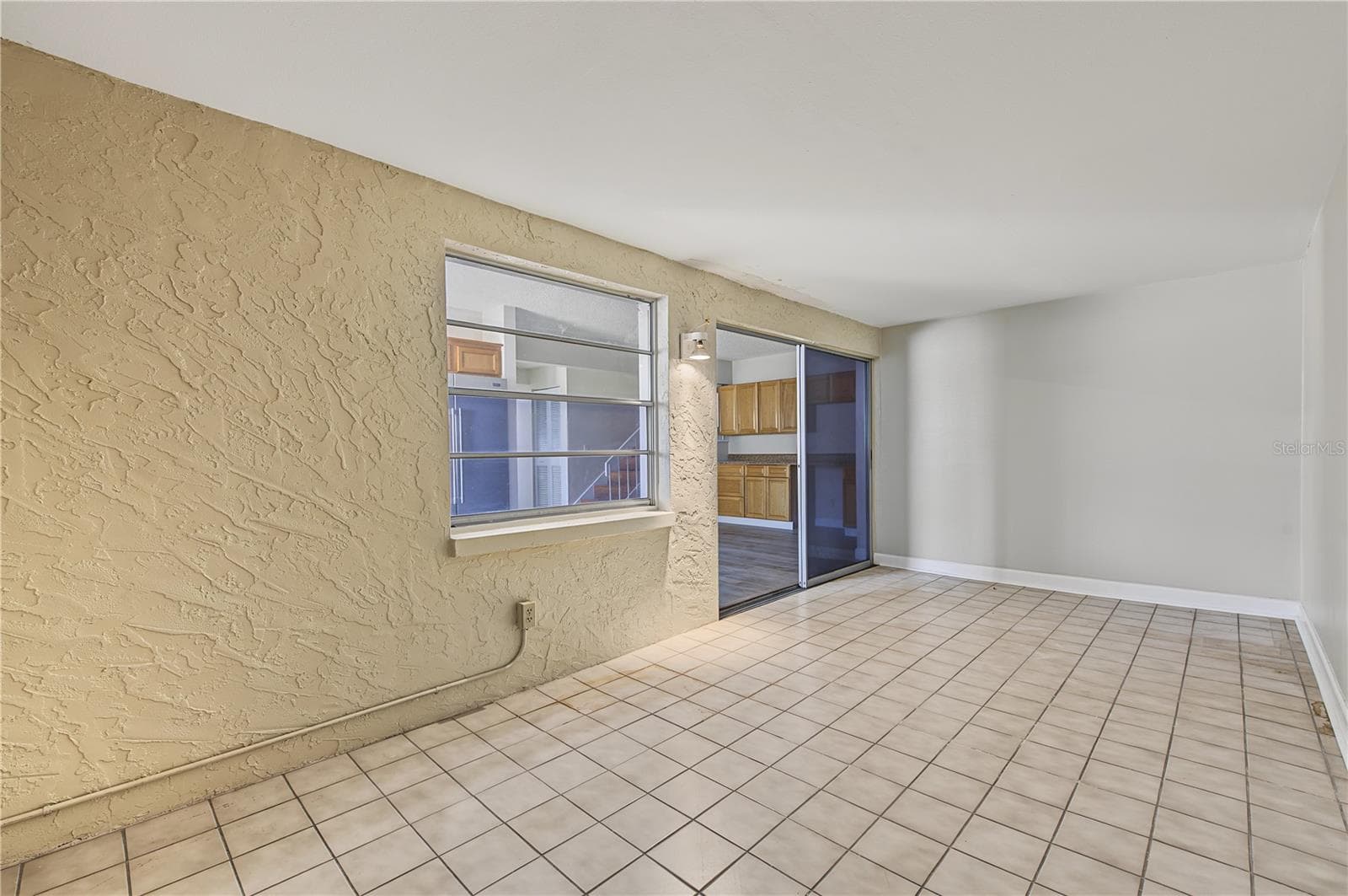 Side Patio off of the kitchen. - 2729 FOXFIRE CT #C, CLEARWATER