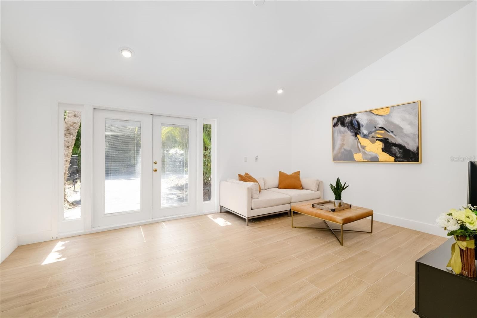 Bright, flexible living area with exterior access—an excellent complement to the adjoining bedroom and bath for guests or extended family. - 403 LONGBOW TRL, OSPREY