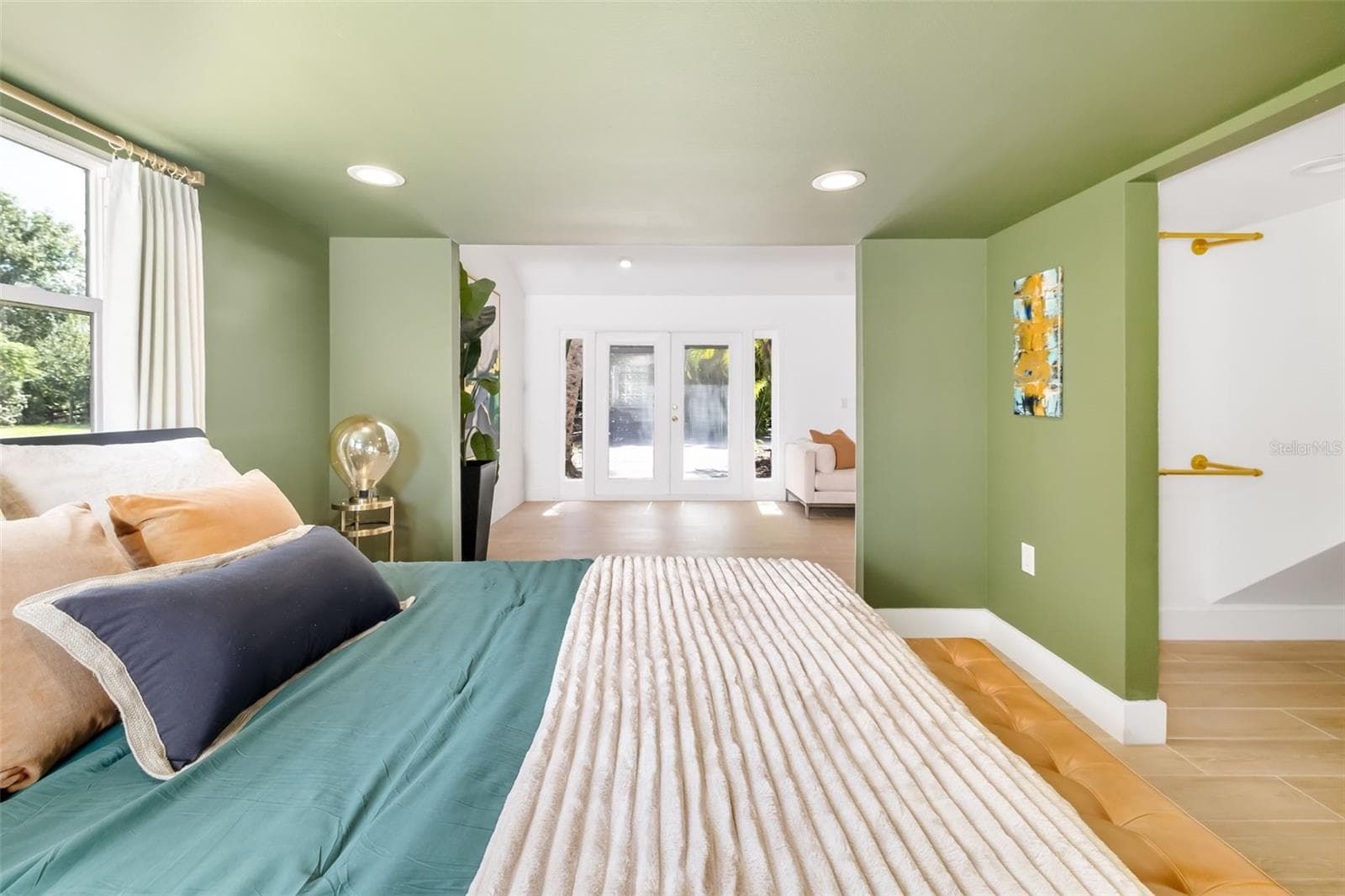 Generously sized bedroom within the flexible guest/in-law-style living area, offering privacy and comfortable space for extended stays. - 403 LONGBOW TRL, OSPREY