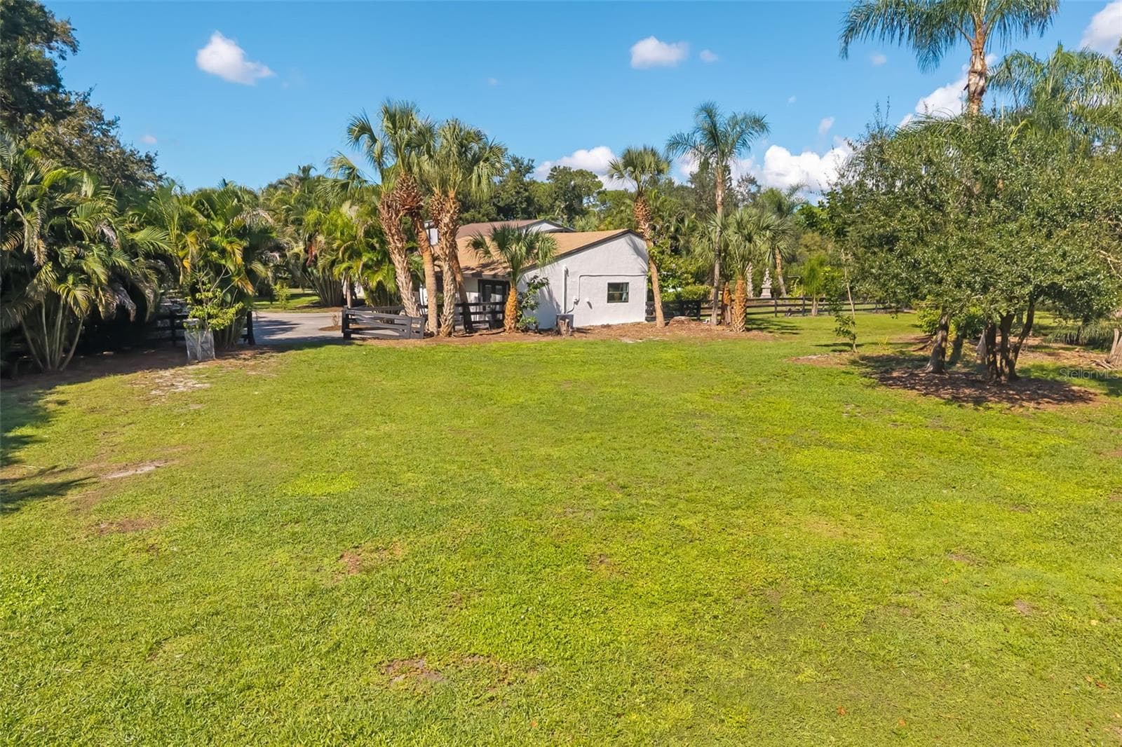 Imagine the possibilities: ample open space for a future RV, boat or collector-car garage, workshop, barn or other accessory structure, subject to Pine Ranch and Sarasota County requirements. - 403 LONGBOW TRL, OSPREY