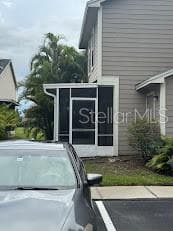 screen porch entrance and glimpse of storage room on right - 12144 BRUCETON WAY #101, ORLANDO
