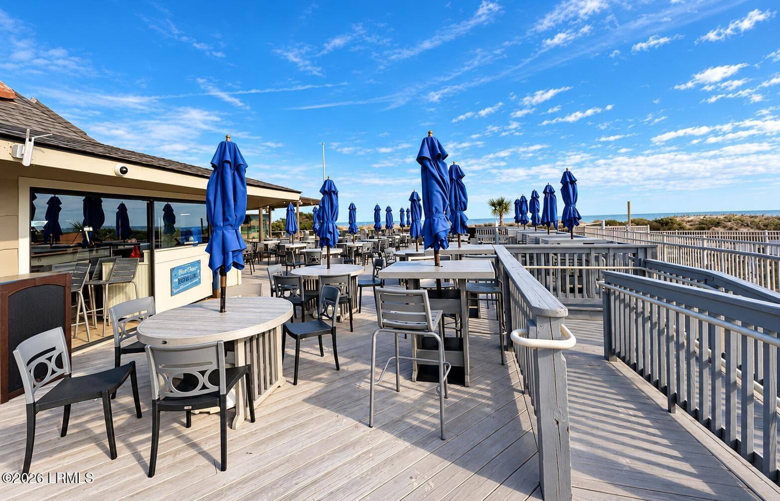 Coastal bar deck with blue umbrellas - 40 Folly Field Road 205b, Hilton Head Island, SC 29928, Hilton Head Island
