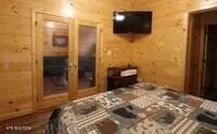 bed double doors - 1695 Misty Hollow Way, Gatlinburg, TN 37738, Gatlinburg