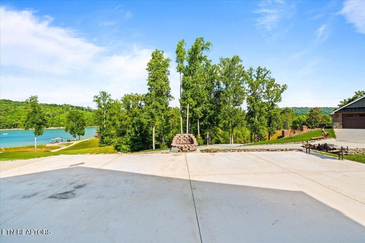Back Concrete Patio with Firepit - 1380 E Norris Point Rd, LaFollette, TN 37766, LaFollette