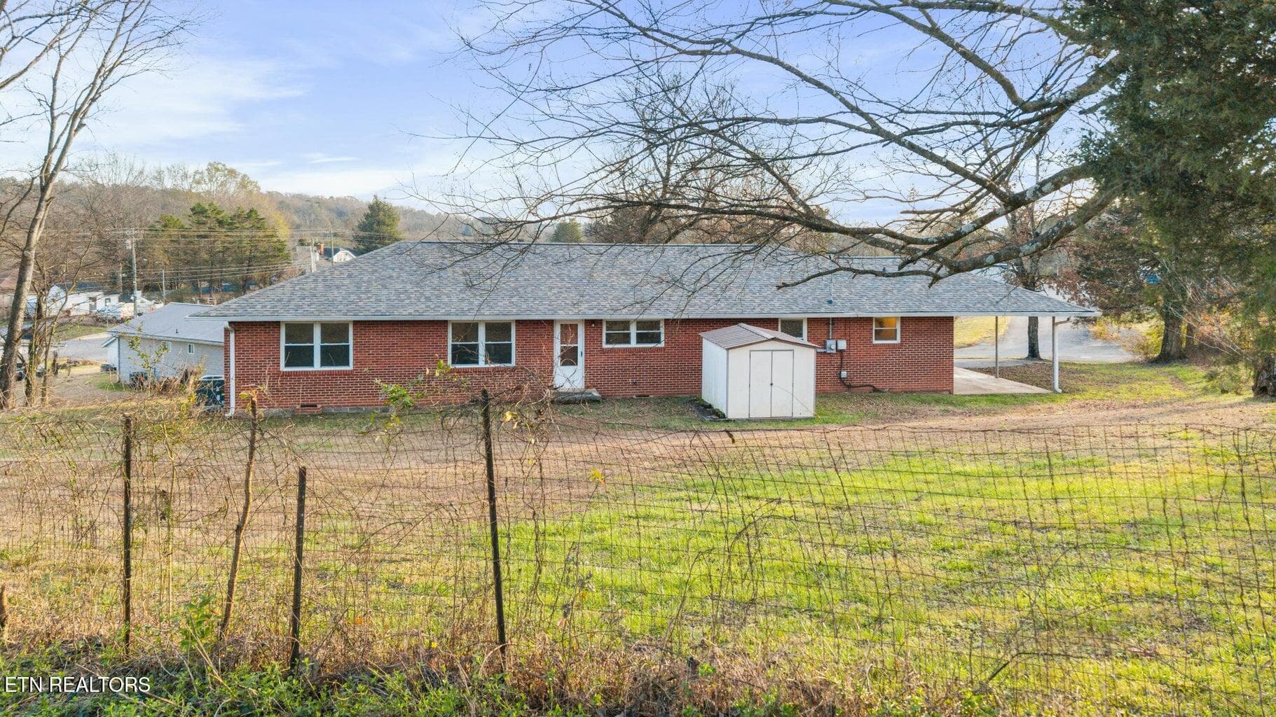 Back view with shed - 128 NE Scott St, Charleston, TN 37310