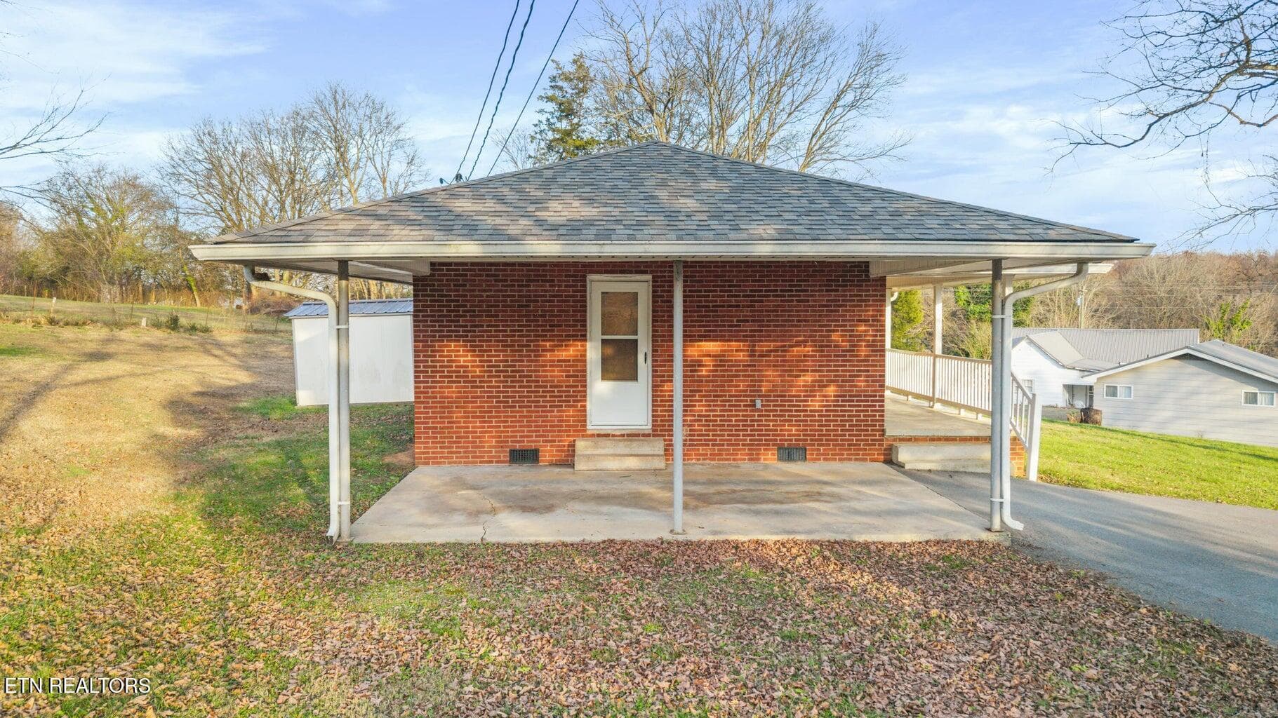 Carport from the side - 128 NE Scott St, Charleston, TN 37310