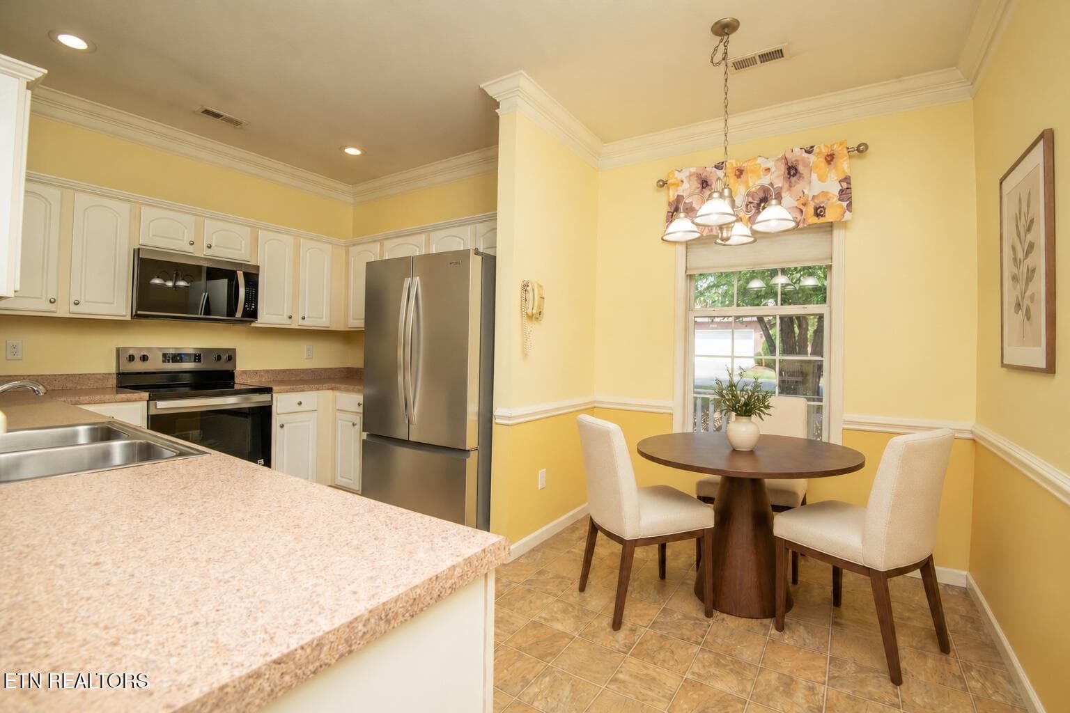 Walnut breakfast nook with cream chairs - 11204 Kilpatrick Way, Knoxville, TN 37932