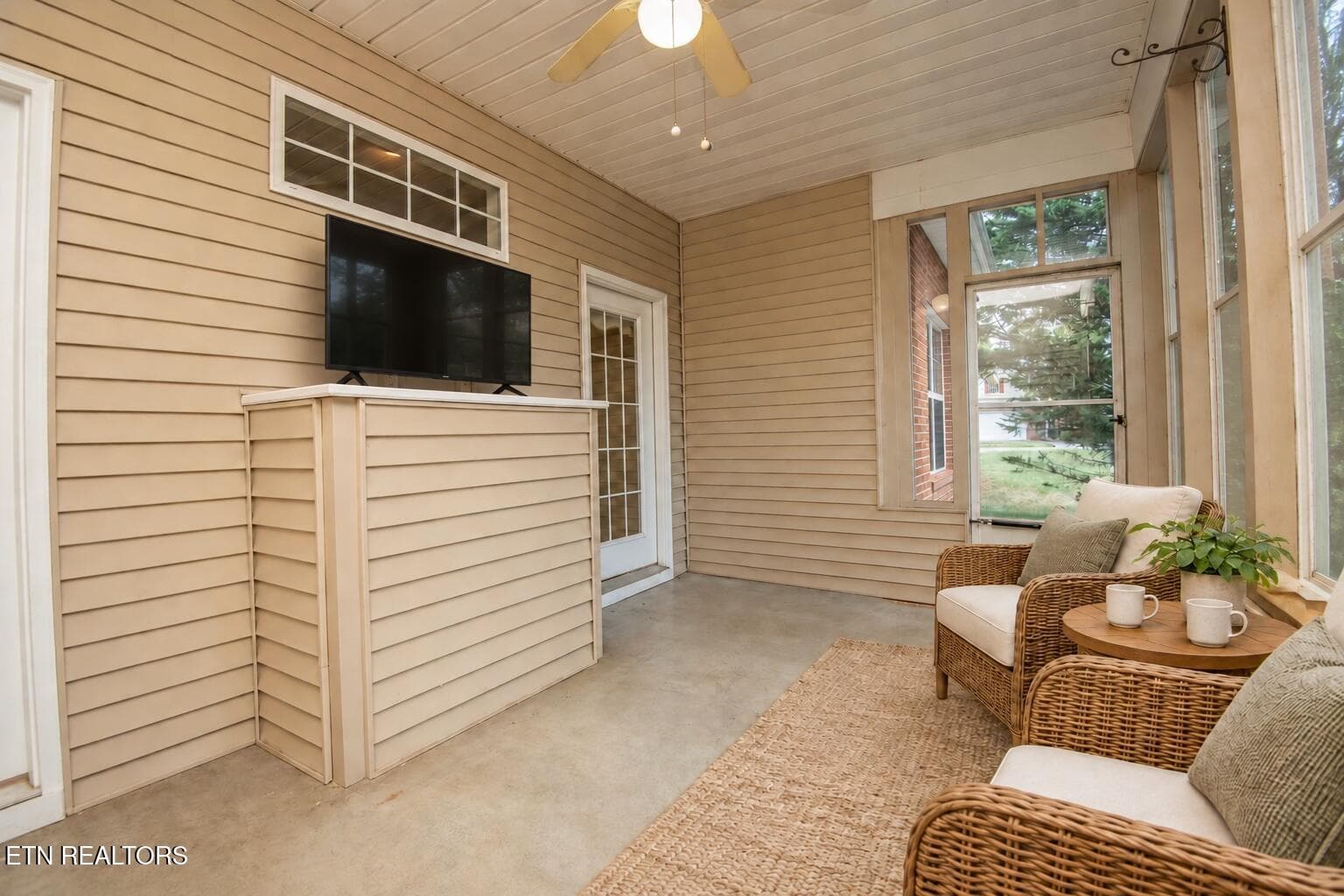 Modern TV on the sunroom ledge - 11204 Kilpatrick Way, Knoxville, TN 37932