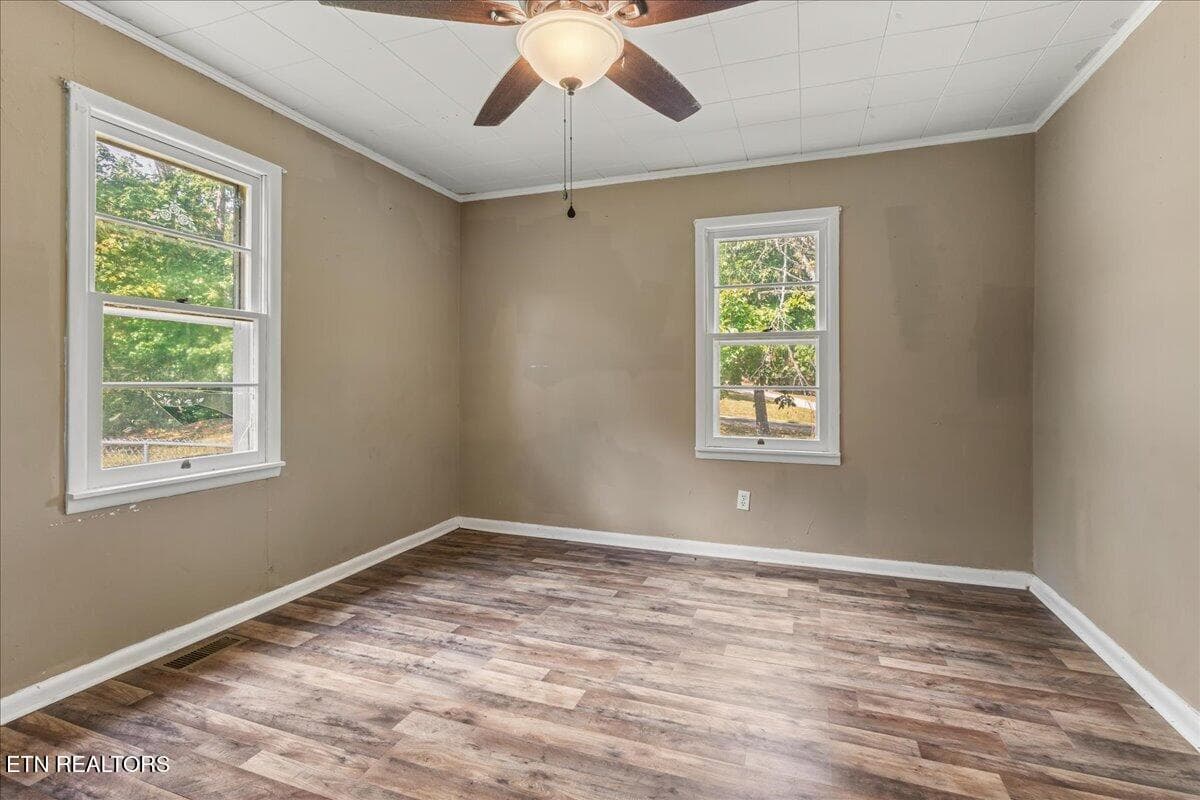 Bedroom with two windows and ceiling fan - 139 County Road 532, Etowah, TN 37331, Etowah