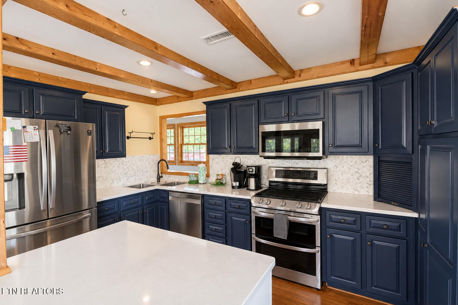 modern_navy_kitchen_with_wood_beams - 504 Matterhorn Drive, Gatlinburg, TN 37738, Gatlinburg