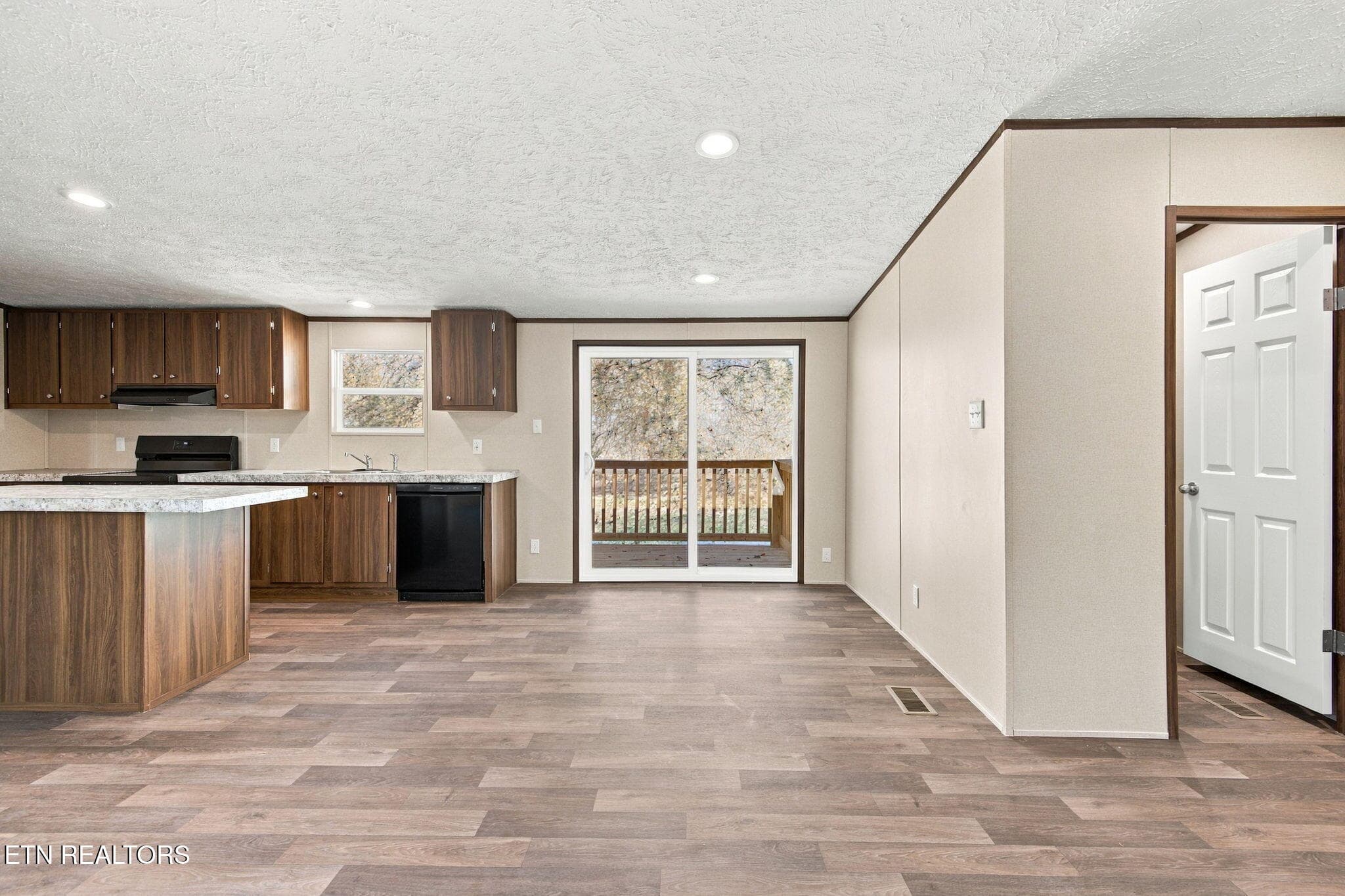 Kitchen and sink side showing outside - 451 Eureka Rd, Rockwood, TN 37854