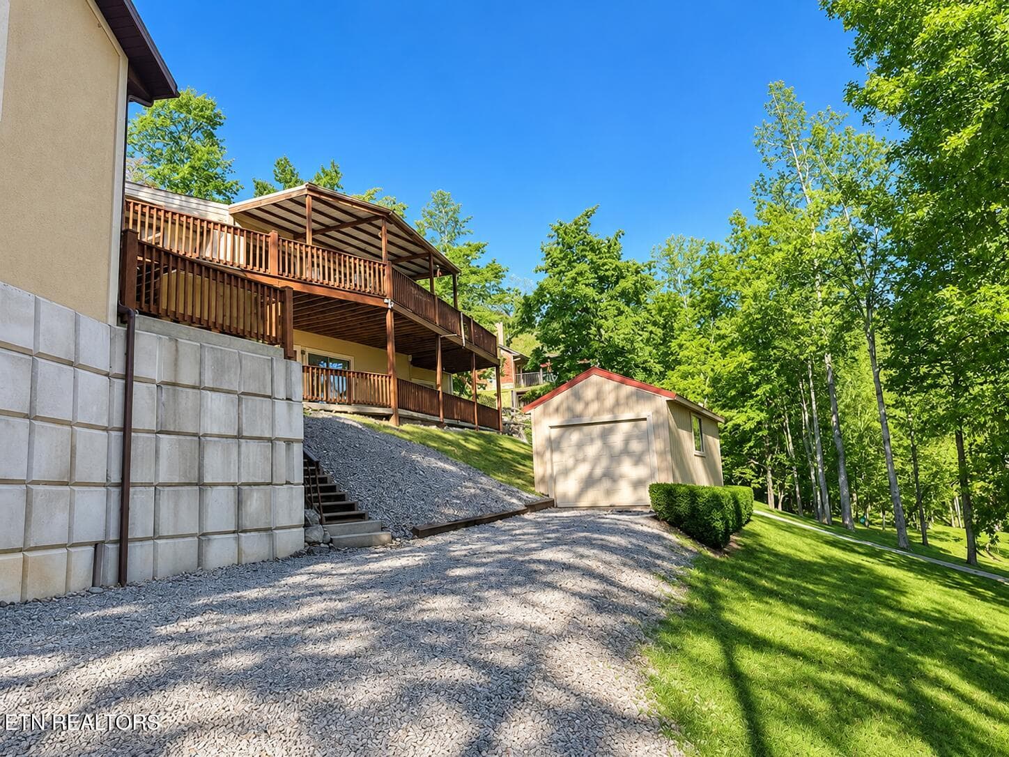 Bright summer real estate exterior - 463 Fox Lake Lane, LaFollette, TN 37766