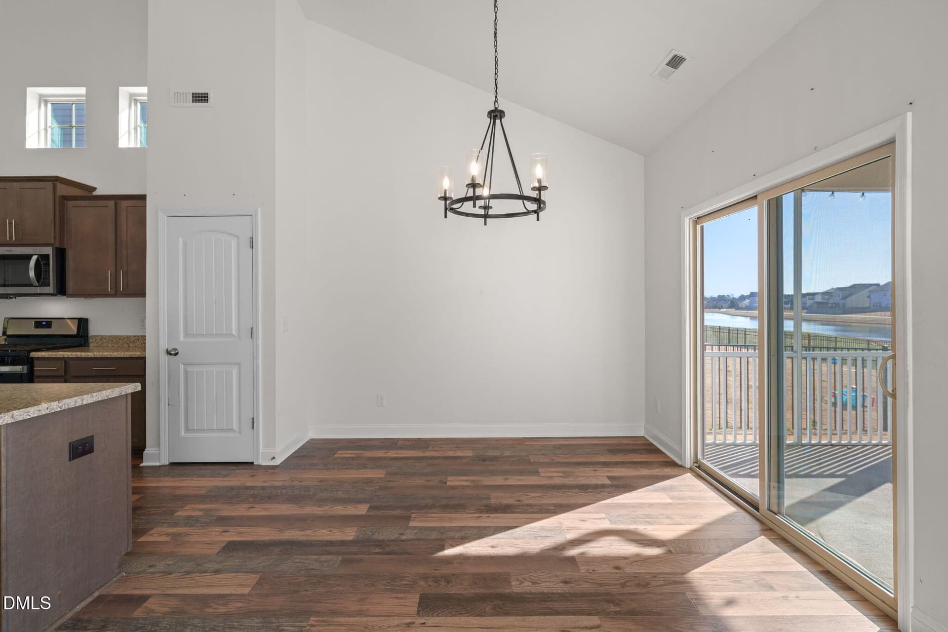 Dining Area w Doors to Screened Porch - 1585 Sage Tree Drive, Zebulon, NC 27597