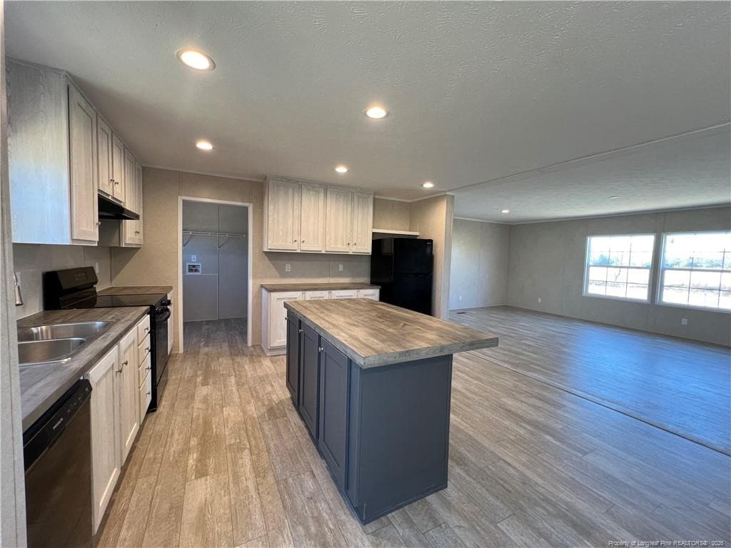 Kitchen with island - 801 Horseshoe Road, Autryville, NC 28318