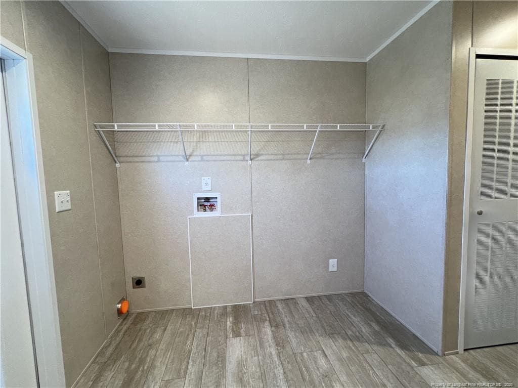 laundry room with backyard access - 801 Horseshoe Road, Autryville, NC 28318