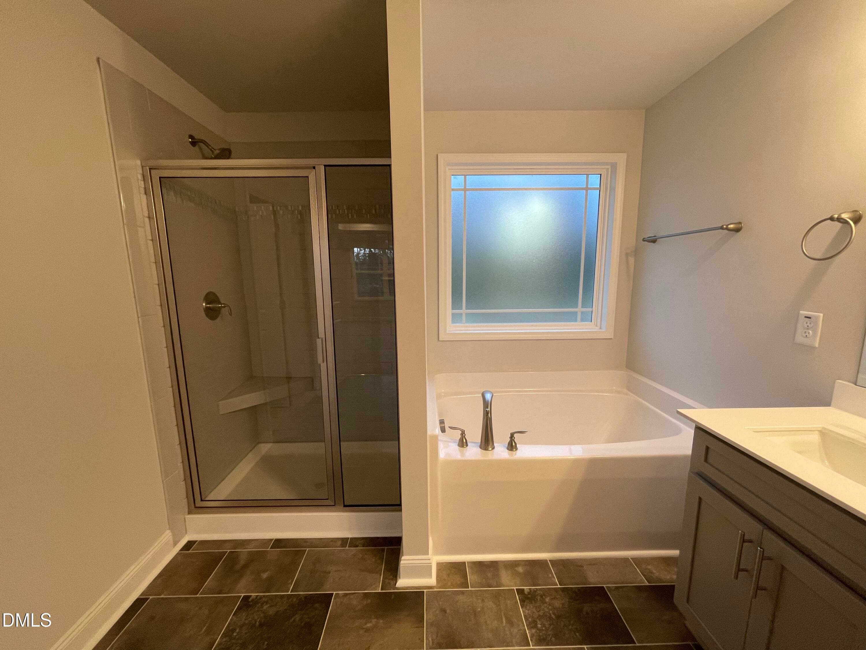 Soaking tub and tiled shower - 193 Falls Of The Cape Drive, Lillington, NC 27546