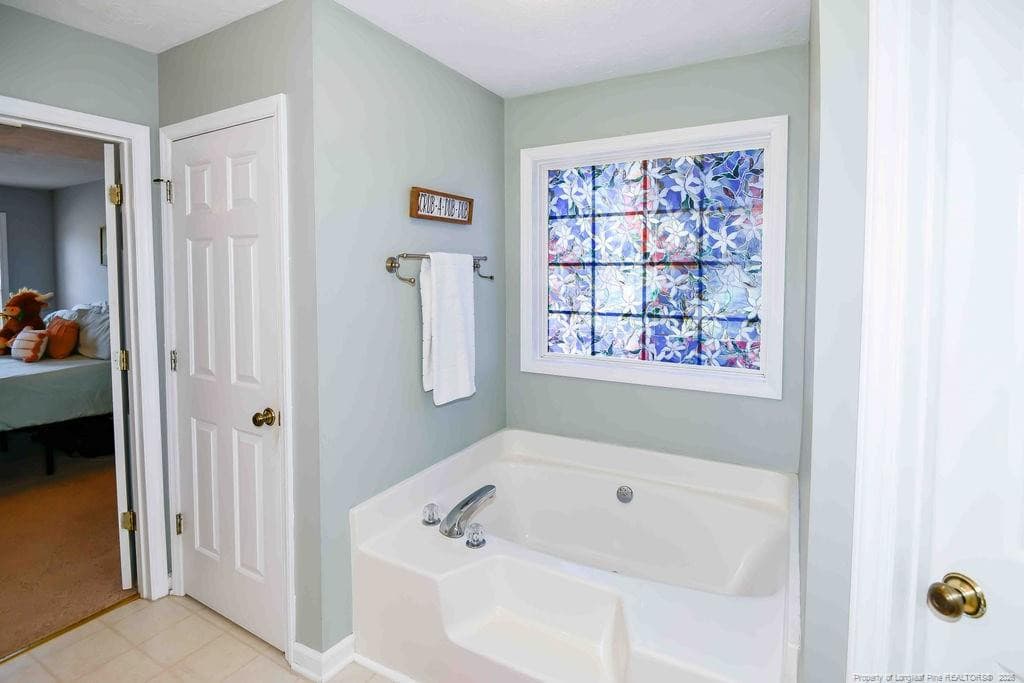Master bath with soaking tub - 256 Arlington Drive, Cameron, NC 28326