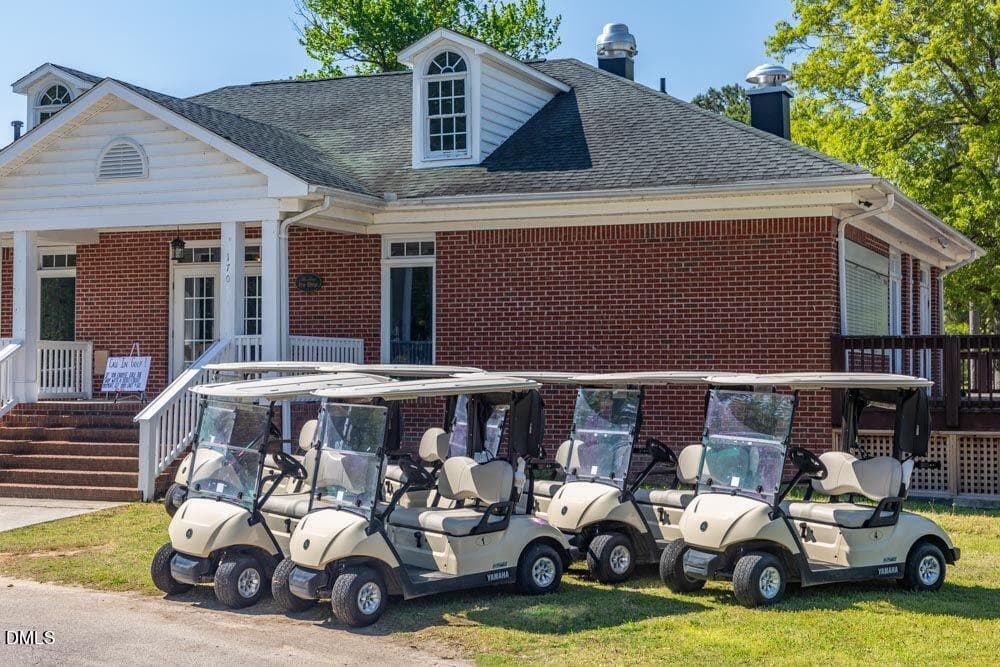 Golf Course clubhouse with carts - 121 Santee Drive, Louisburg, NC 27549, Louisburg