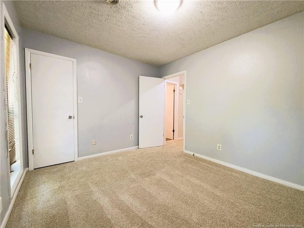 Bedroom 2 f eatures corner closet. - 1327 Fraser Drive, Fayetteville, NC 28303, Fayetteville