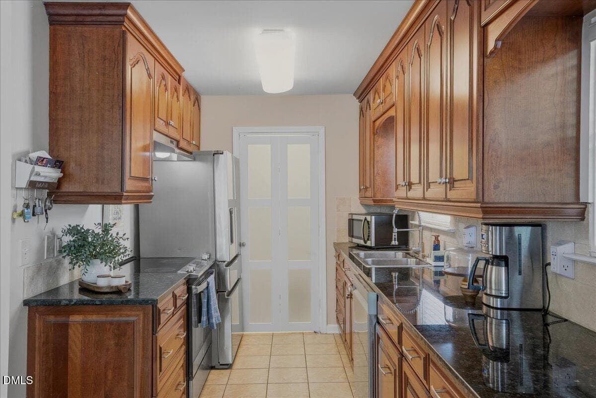 kitchen with bifold door closed_901 - 901 Dorothy Sanders Way, Raleigh, NC 27601, Raleigh