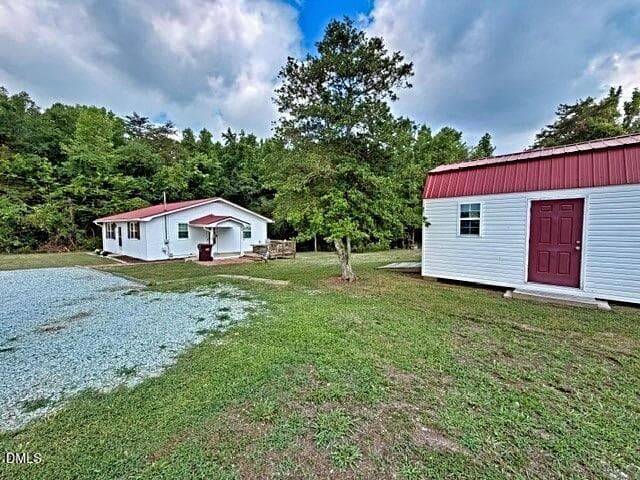 3555 side yard with building (1) - 3555 Antioch Church Road, Timberlake, NC 27583, Timberlake