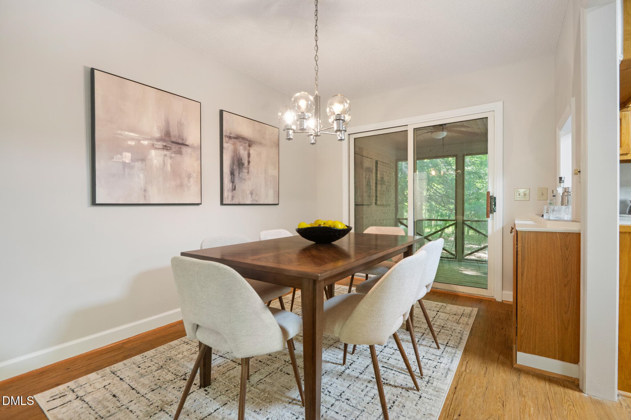Dining area and screened porch beyond. - 9021 Collins Creek Drive, Chapel Hill, NC 27516, Chapel Hill