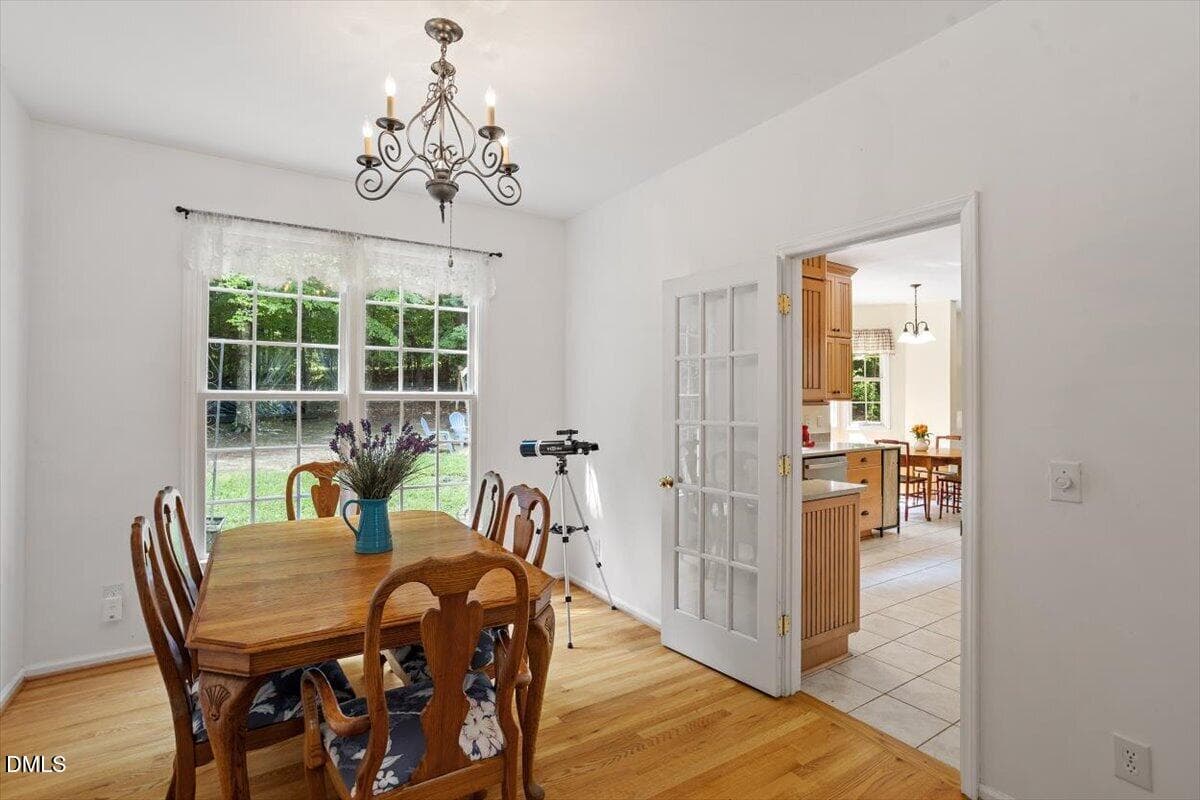 Dining room overlooking lush backyard - 87 Danning Drive, Chapel Hill, NC 27516, Chapel Hill