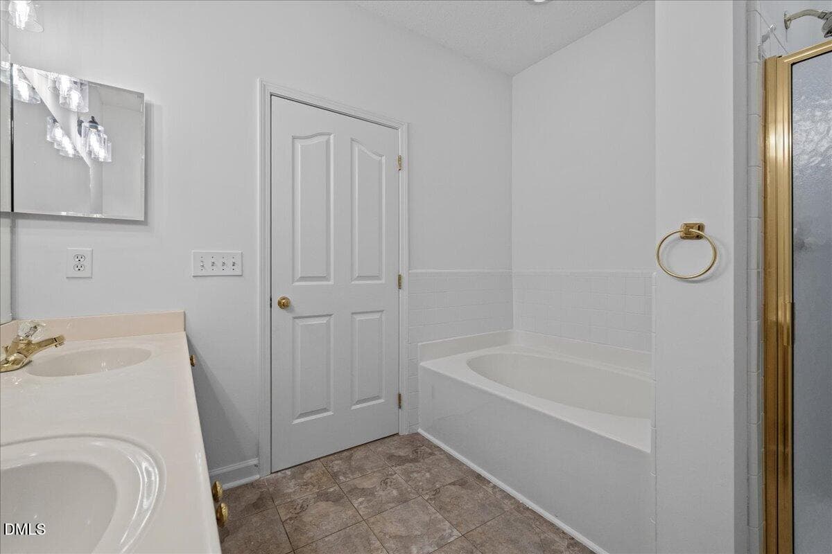 primary bath dual vanity and shower - 7647 Astoria Place, Raleigh, NC 27612, Raleigh