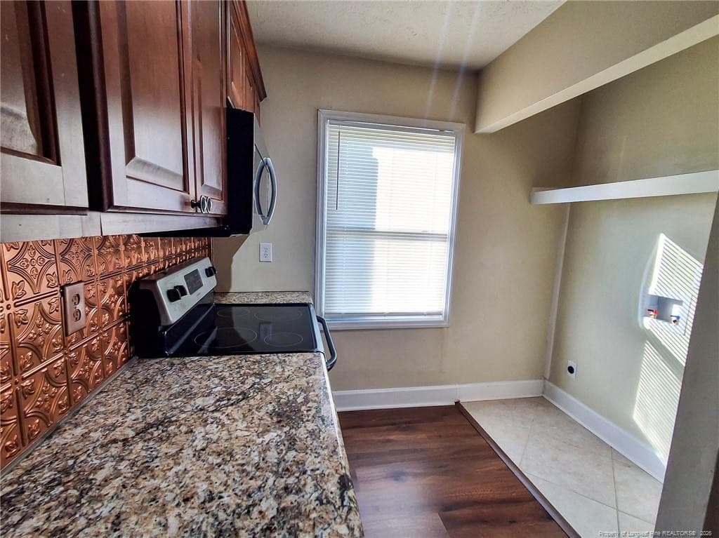 Kitchen with laundry hook ups - 406 Kirkcaldy Court, Fayetteville, NC 28314, Fayetteville