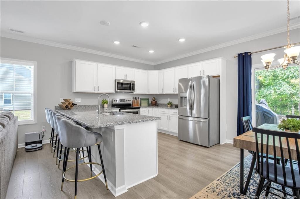 KITCHEN TO DINING SPACE - 105 Nectar Lane, Bunnlevel, NC 28323