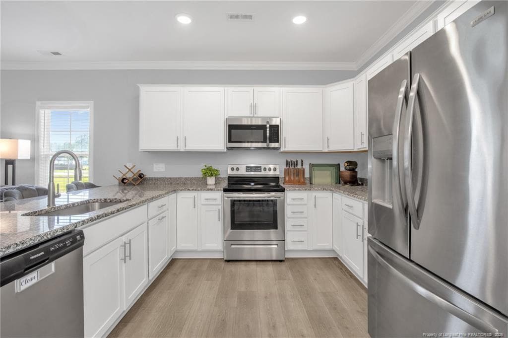 KITCHEN WITH WHITE CABINETS - 105 Nectar Lane, Bunnlevel, NC 28323