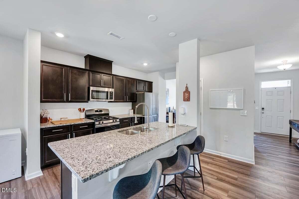Granite kitchen island - 285 Carolina Maple Drive, Franklinton, NC 27525