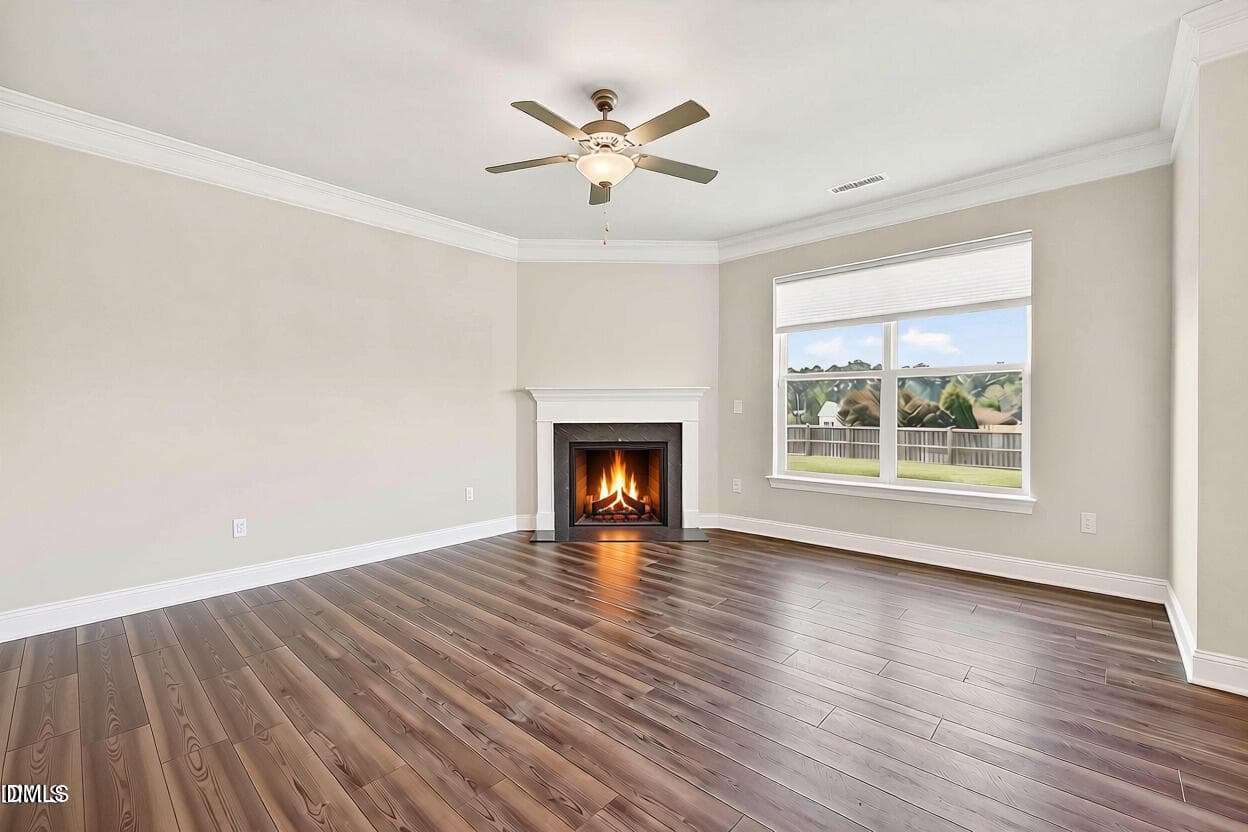 Livingroom showing fireplace lit and emp - 4324 Beckel Road, Willow Springs, NC 27592