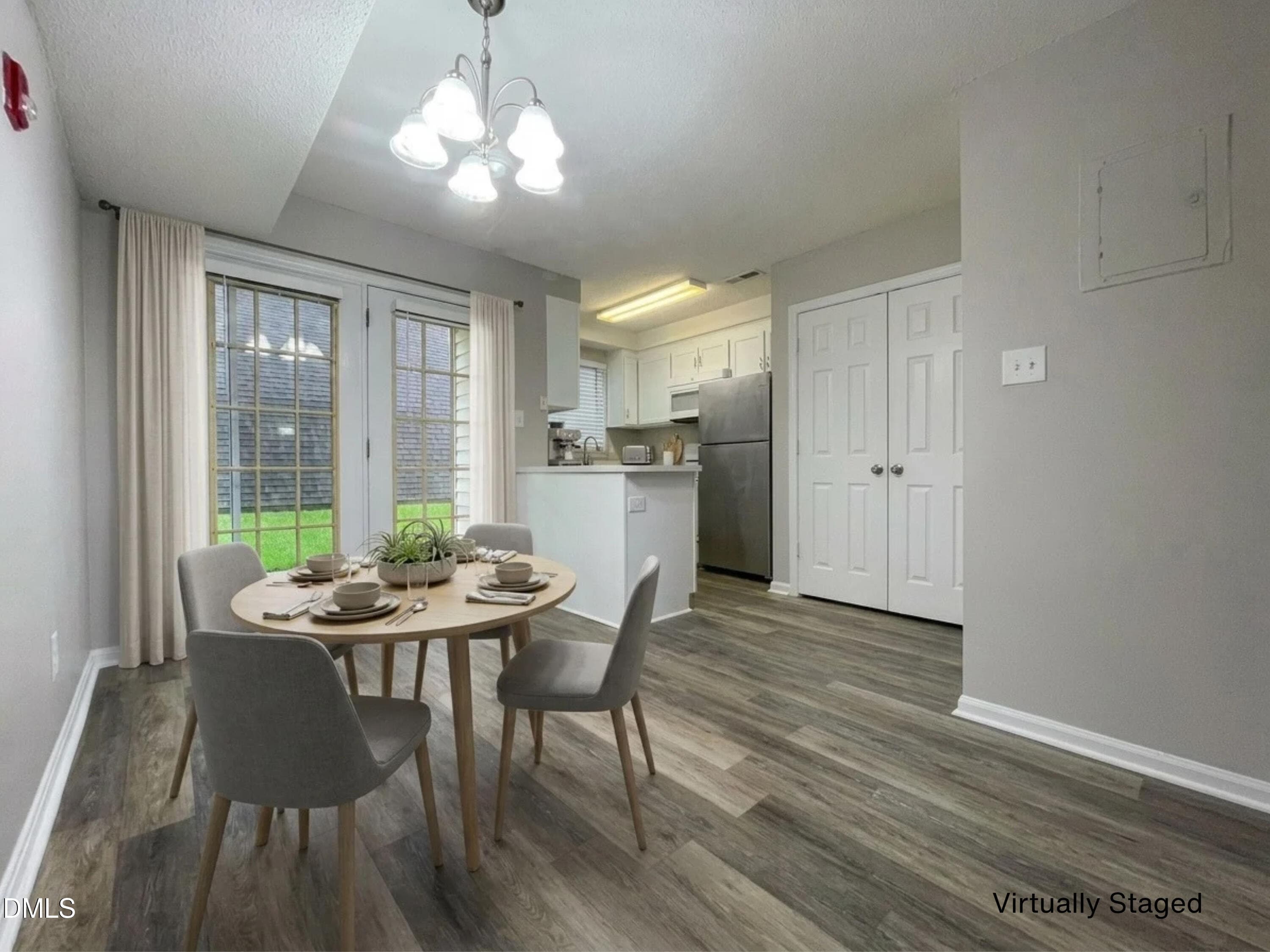 Dining Area and Kitchen Staged - 4703 Blue Bird Court F, Raleigh, NC 27606, Raleigh