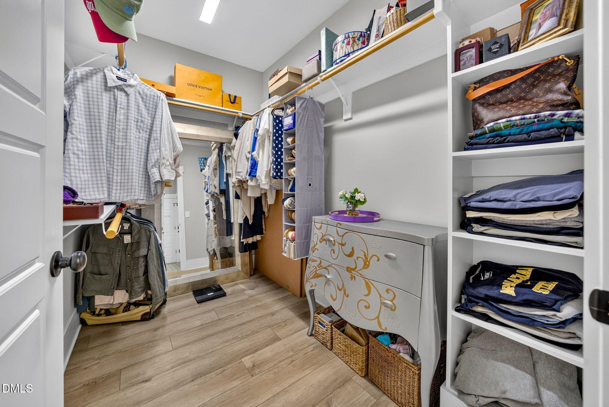 Primary closet with wood shelving - 1100 Greatland Road, Durham, NC 27703