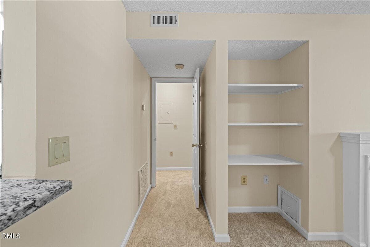 Hallway to Primary Bedroom - 1301 Hillbrow Lane 203, Raleigh, NC 27615