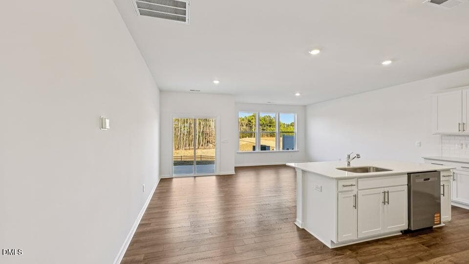 KITCHEN, DINING ROOM, AND LIVING ROOM - 7450 Eden Bush Drive, Raleigh, NC 27604