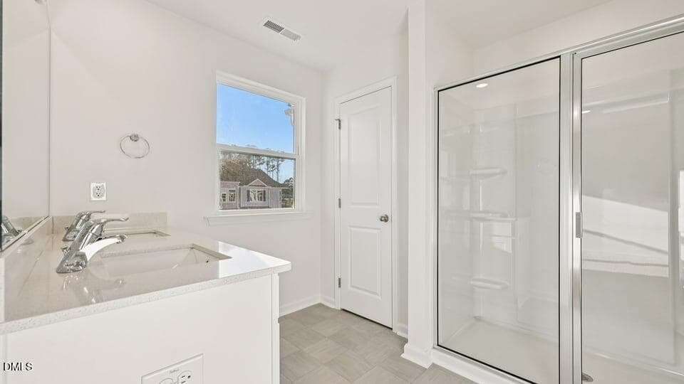 PRIMARY SUITE BATHROOM - 7450 Eden Bush Drive, Raleigh, NC 27604