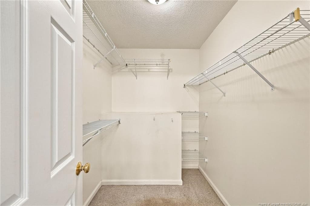 primary walk in closet - 137 Winsford Circle, West End, NC 27376, West End