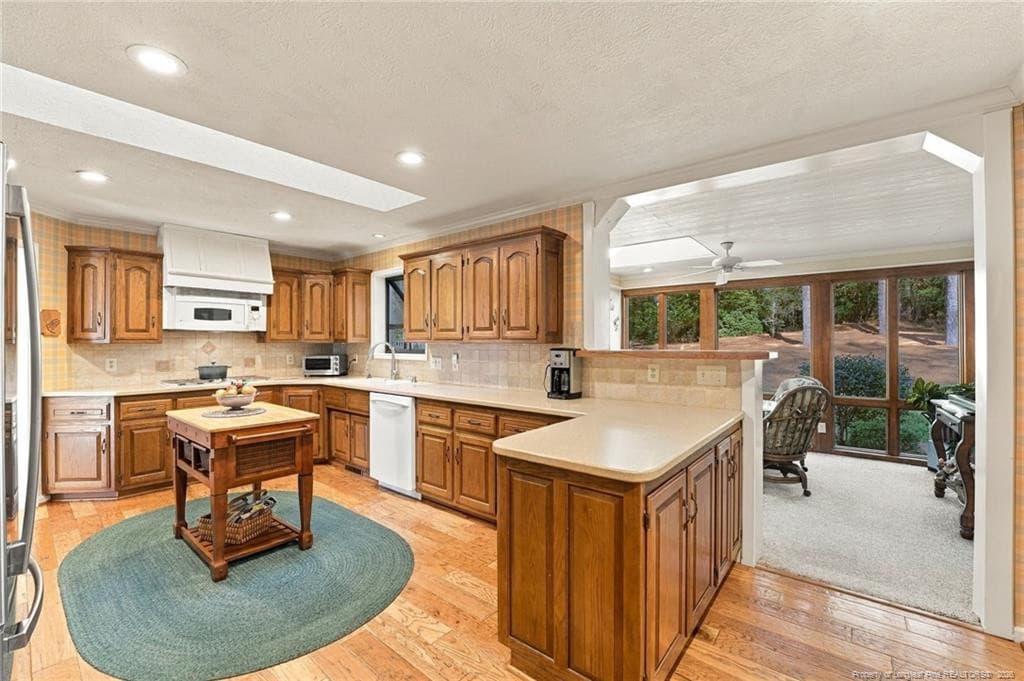 Kitchen and Sunroom - 715 Lake Forest Drive SE, Pinehurst, NC 28374