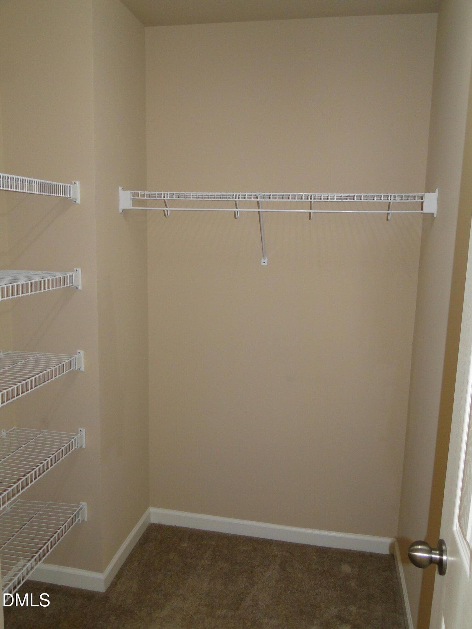 1 of 2 Primary Bedroom Closets - 5817 Abbington Way, Raleigh, NC 27610