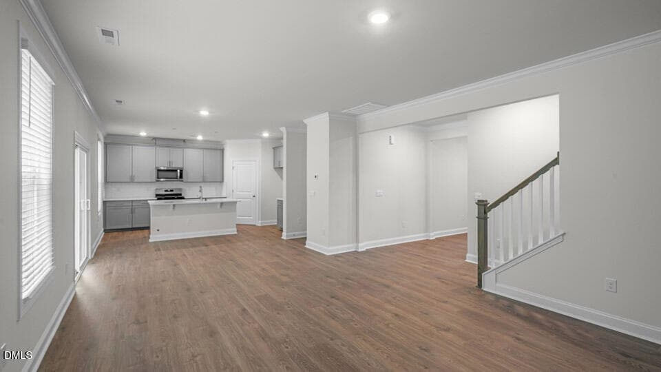 FAMILY ROOM AND STAIRWELL - 5021 Dezola Street, Apex, NC 27539