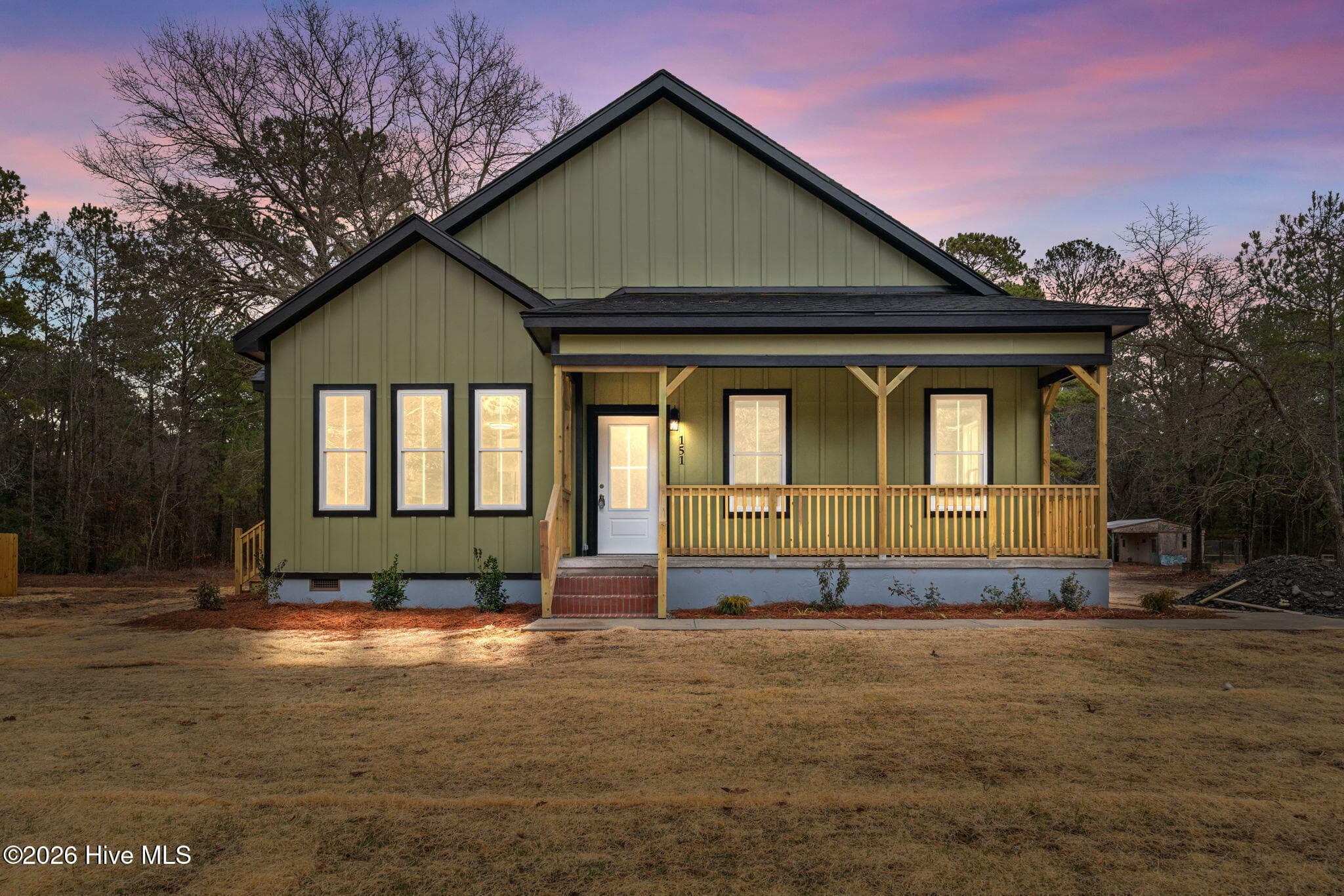 Front exterior twilight view virtually staged. - 151 Creek Bend Drive, Vass, NC 28394
