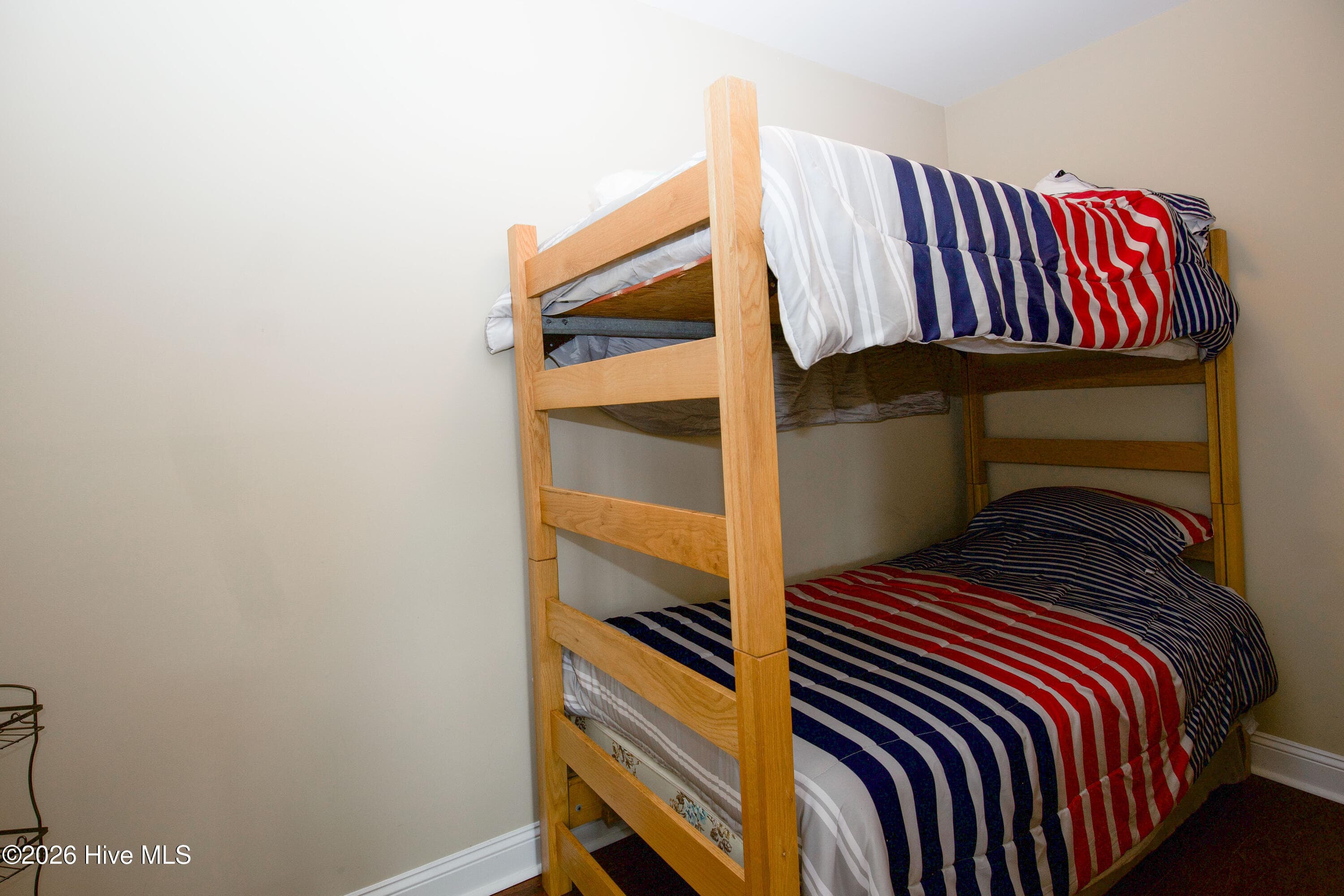 Additional lower-level room, currently arranged with bunk beds, with plenty of room for activities outside the room in the recreation area. - 899 Seagull Drive, Vass, NC 28394, Vass