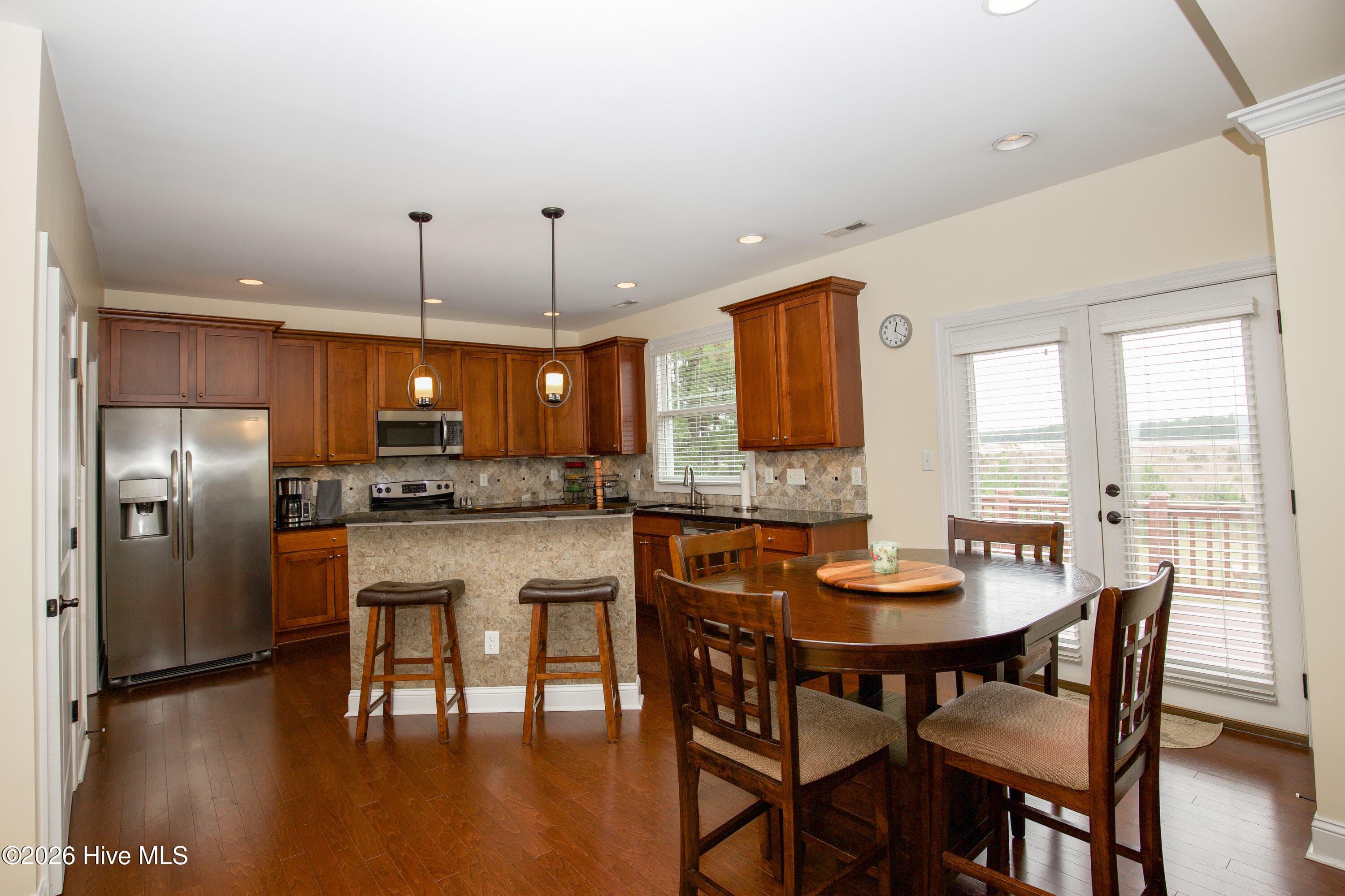 Breakfast area beside the kitchen, with French doors to the open deck. - 899 Seagull Drive, Vass, NC 28394, Vass