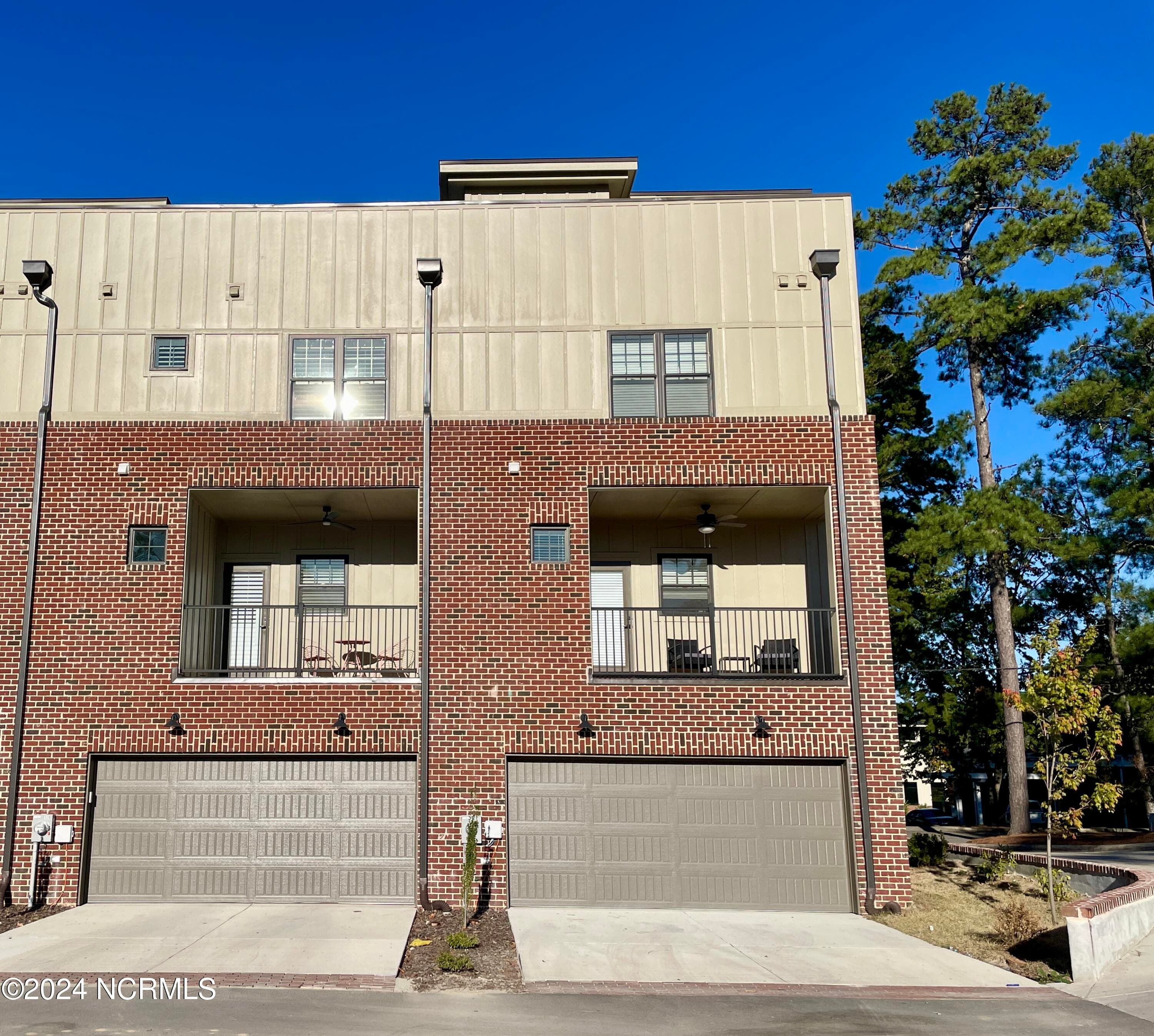 View of garage entrance in back of building - 129 Lexington Lane, Southern Pines, NC 28387