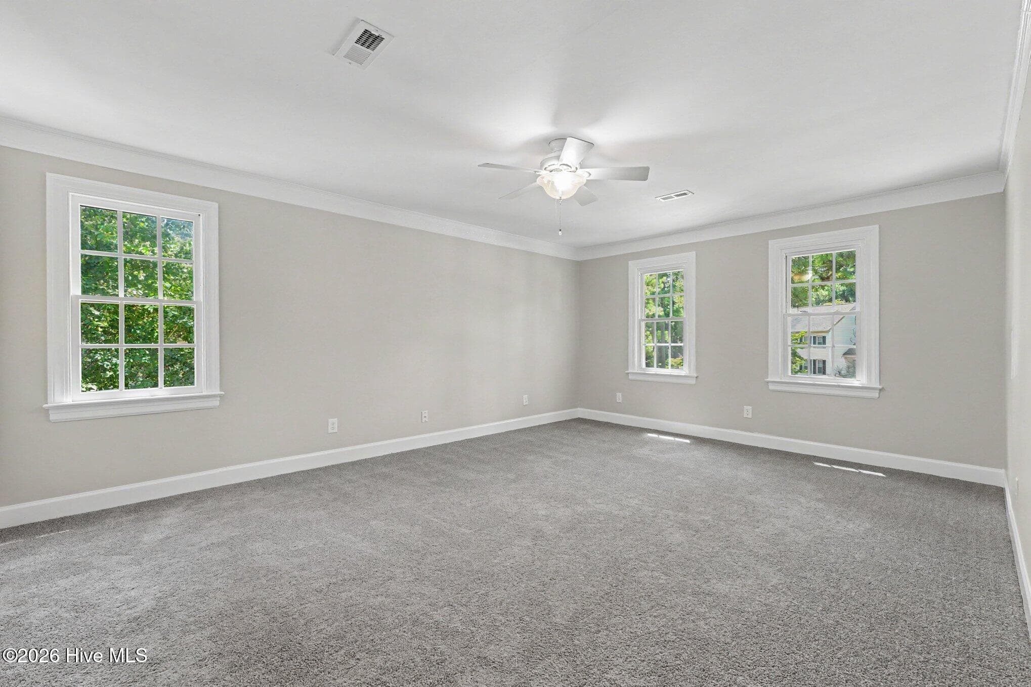 Master bedroom with crown molding, ceiling fan and private bath - 2112 Burnside Drive NW, Wilson, NC 27896