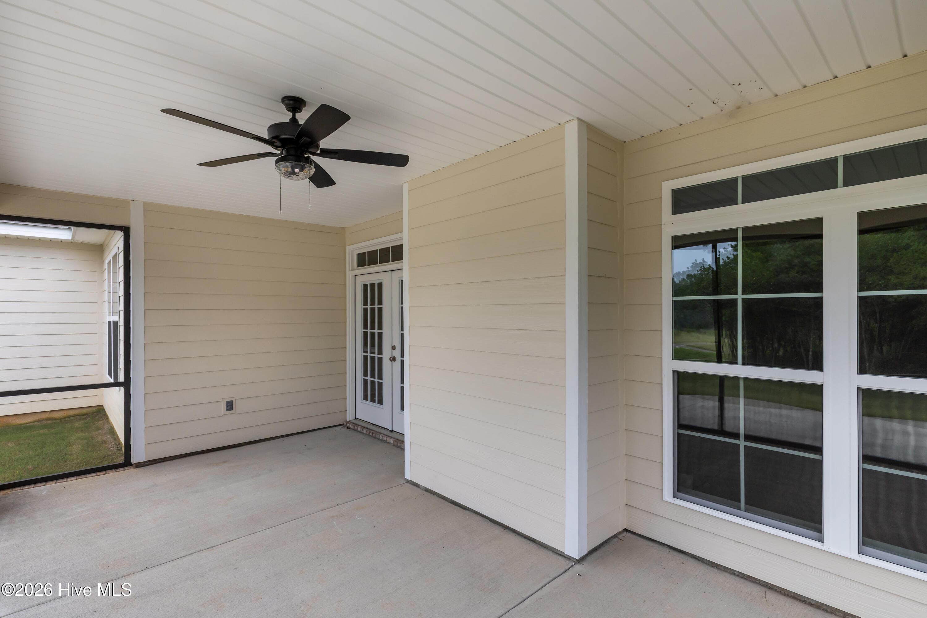 Covered back porch includes a ceiling fan for added comfort - 1200 Bellingham Drive, Beech Island, SC 29842